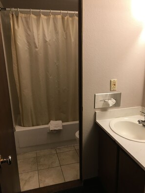 Standard Room, 1 King Bed | Bathroom | Combined shower/tub, jetted tub, towels