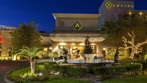 A hotel with a modern facade, a prominent logo, and a well-lit entrance. - Hotel Araiza Mexicali (Mexicali)