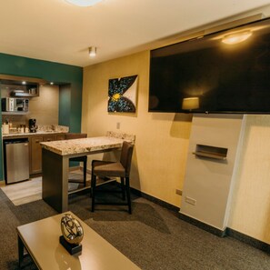 Suite, 1 King Bed | Private kitchen | Coffee/tea maker, highchair