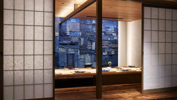 A room with a wooden ceiling, a large window with a view of a textured wall, and a small plant on the windowsill. - Hilton Tokyo (Tokyo)