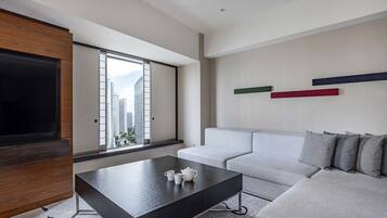 Twin Jr Suite Executive | Living area | 55-inch LCD TV with digital channels, TV