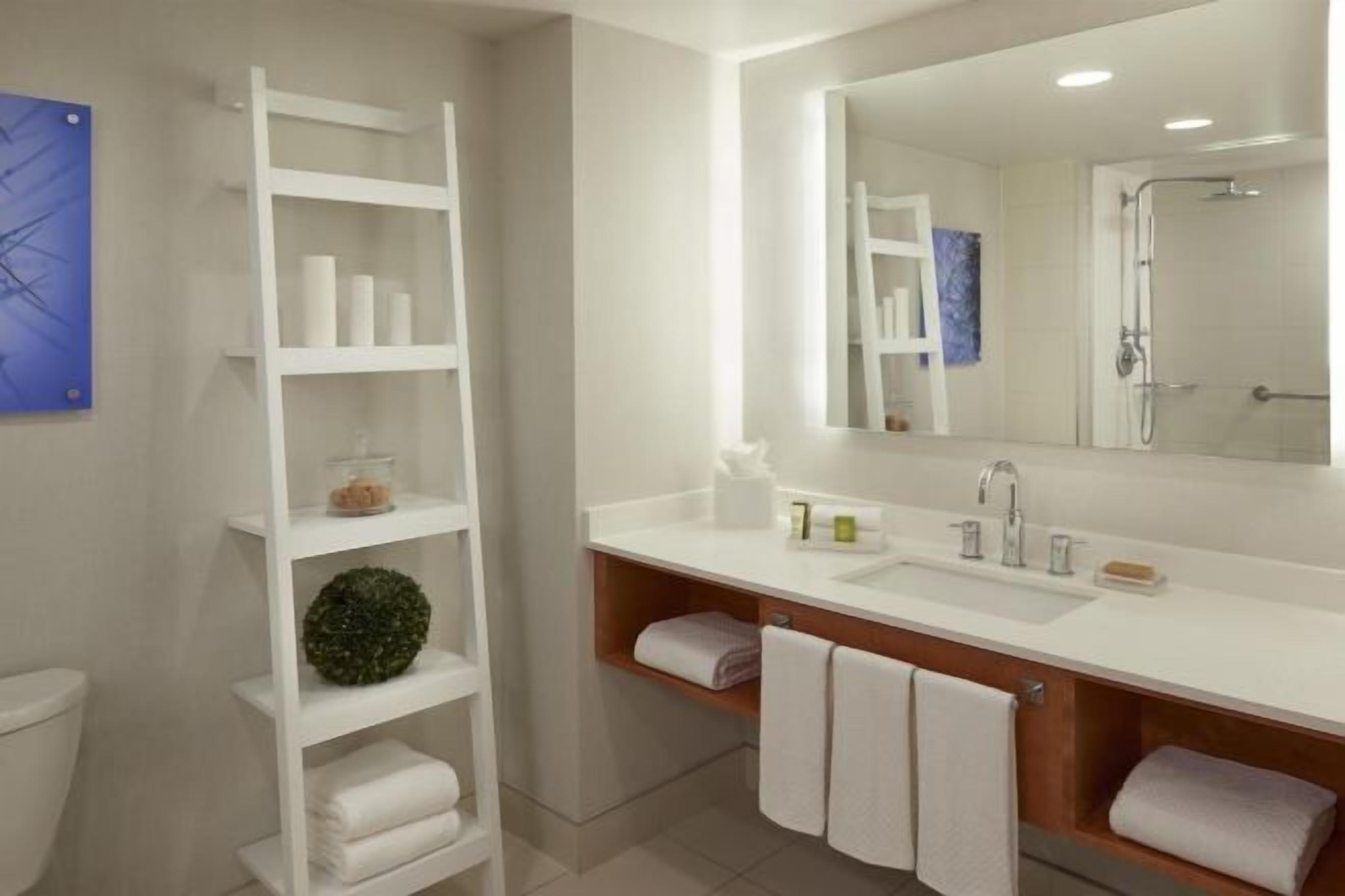 Designer toiletries, hair dryer, towels, soap