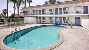 A two-story motel with a swimming pool. - Motel 6 Lake Elsinore, CA (Lake Elsinore)