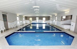 Indoor pool, open 8:00 AM to 8:00 PM, pool loungers