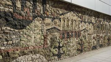 A stone wall with a mosaic pattern.