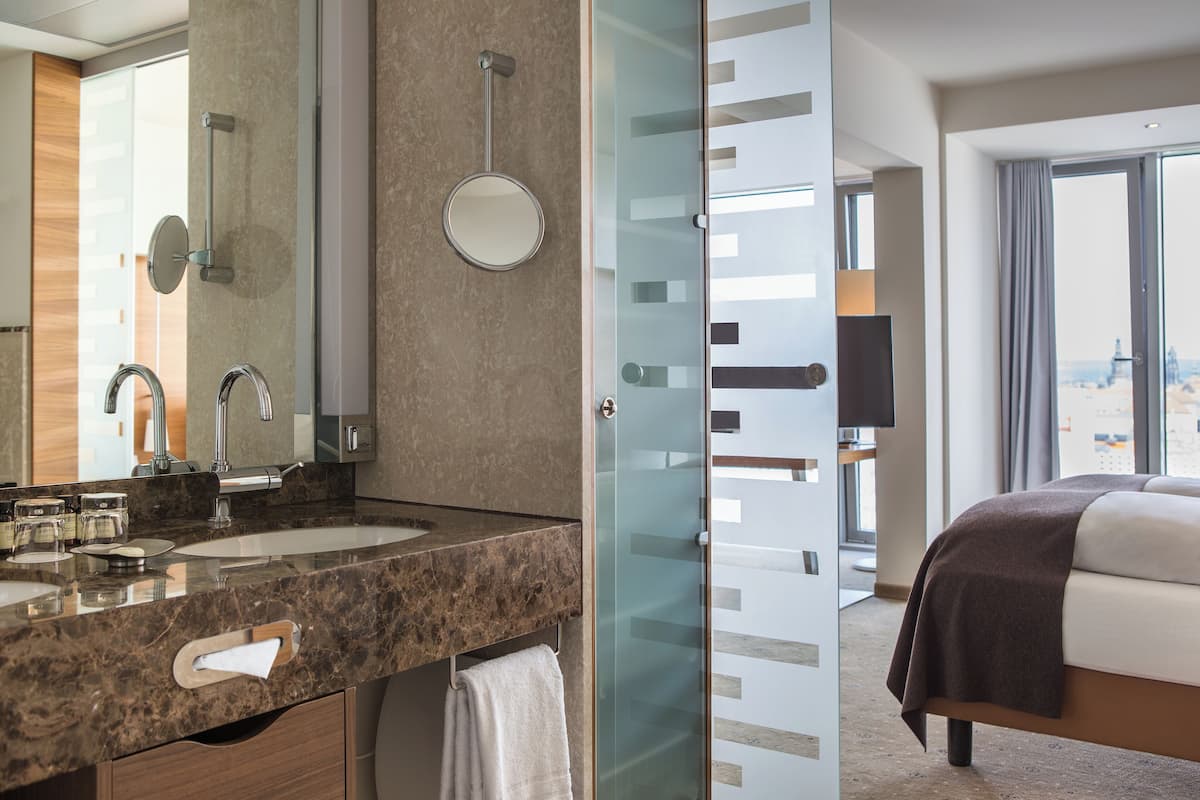 eco-friendly toiletries, hair dryer, towels