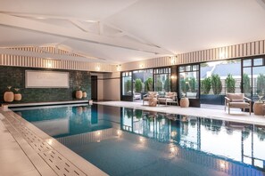 Indoor pool, pool umbrellas, sun loungers