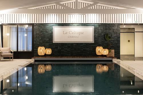 Indoor pool, pool umbrellas, pool loungers