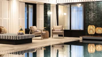 Indoor pool, pool umbrellas, sun loungers