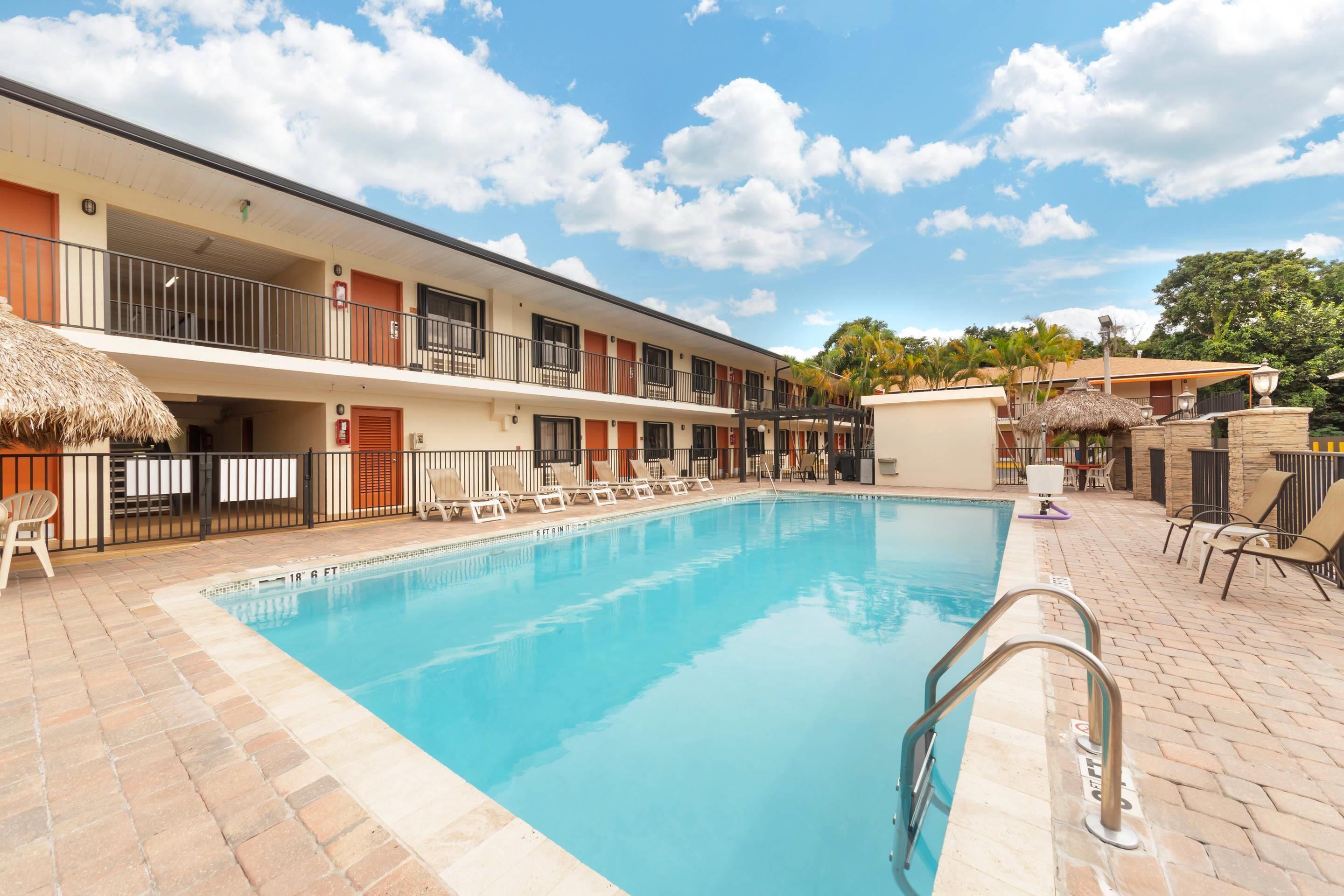 Outdoor pool, a heated pool, open 8:00 AM to 8:30 PM, pool loungers