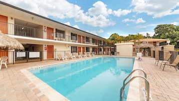 Outdoor pool, a heated pool, open 8:00 AM to 8:30 PM, pool loungers