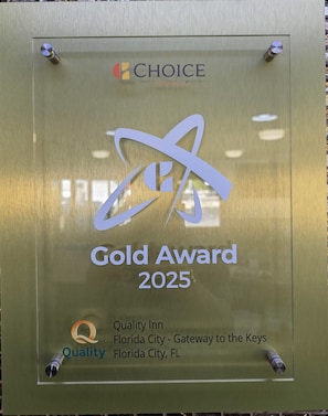 A plaque with the text "Gold Award 2025" and "Quality Inn Florida City - Gateway to the Keys Florida City, FL". - Quality Inn Florida City - Gateway to the Keys (Florida City)