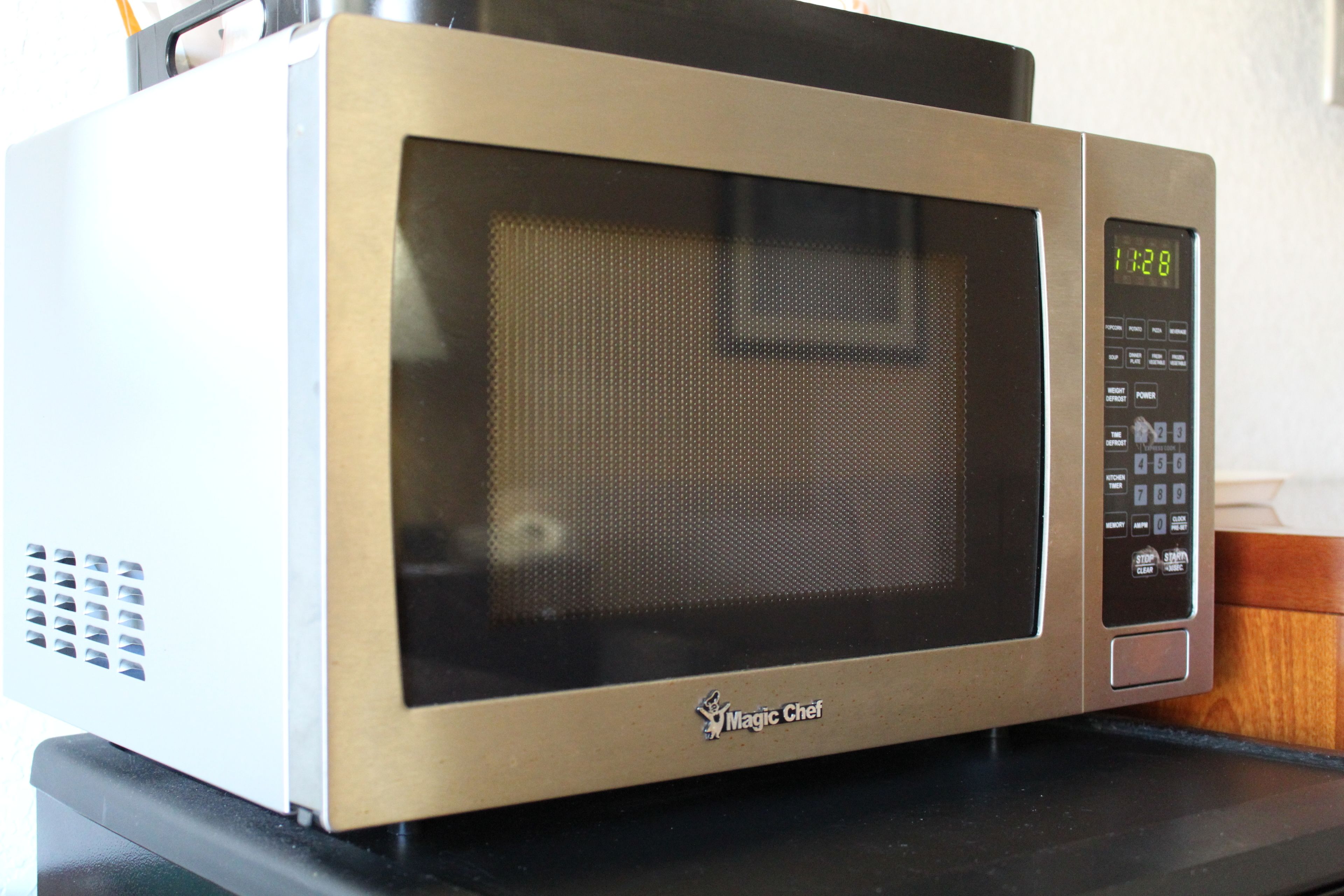 A microwave oven with a digital display and control panel.