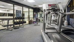 A gym with treadmills, dumbbells, and weight machines. - Quality Inn Lexington -Horse Park (Lexington)