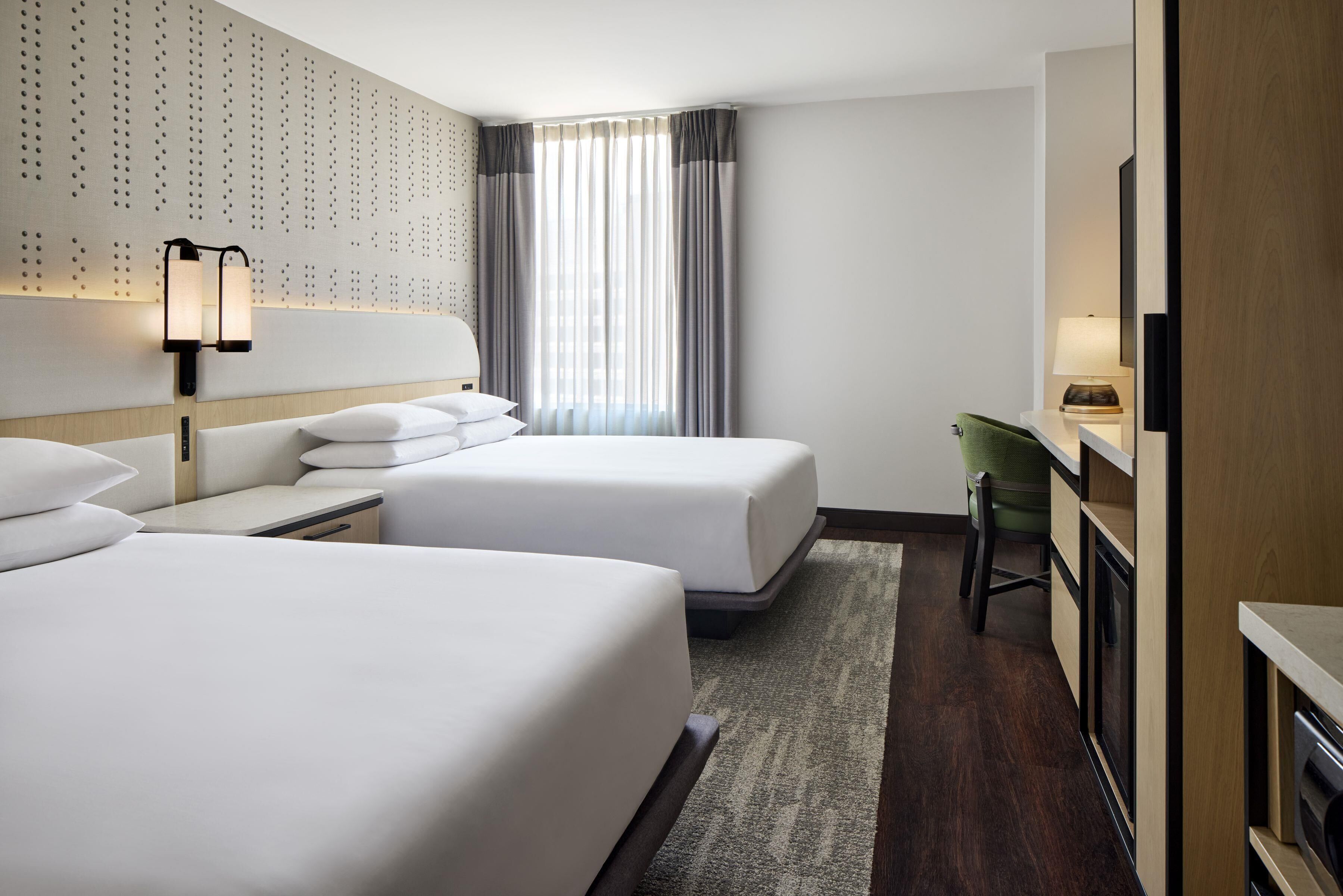 Premium bedding, down comforters, pillowtop beds, in-room safe