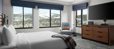 A modern hotel room with a large bed, a chair, a dresser, and a TV.