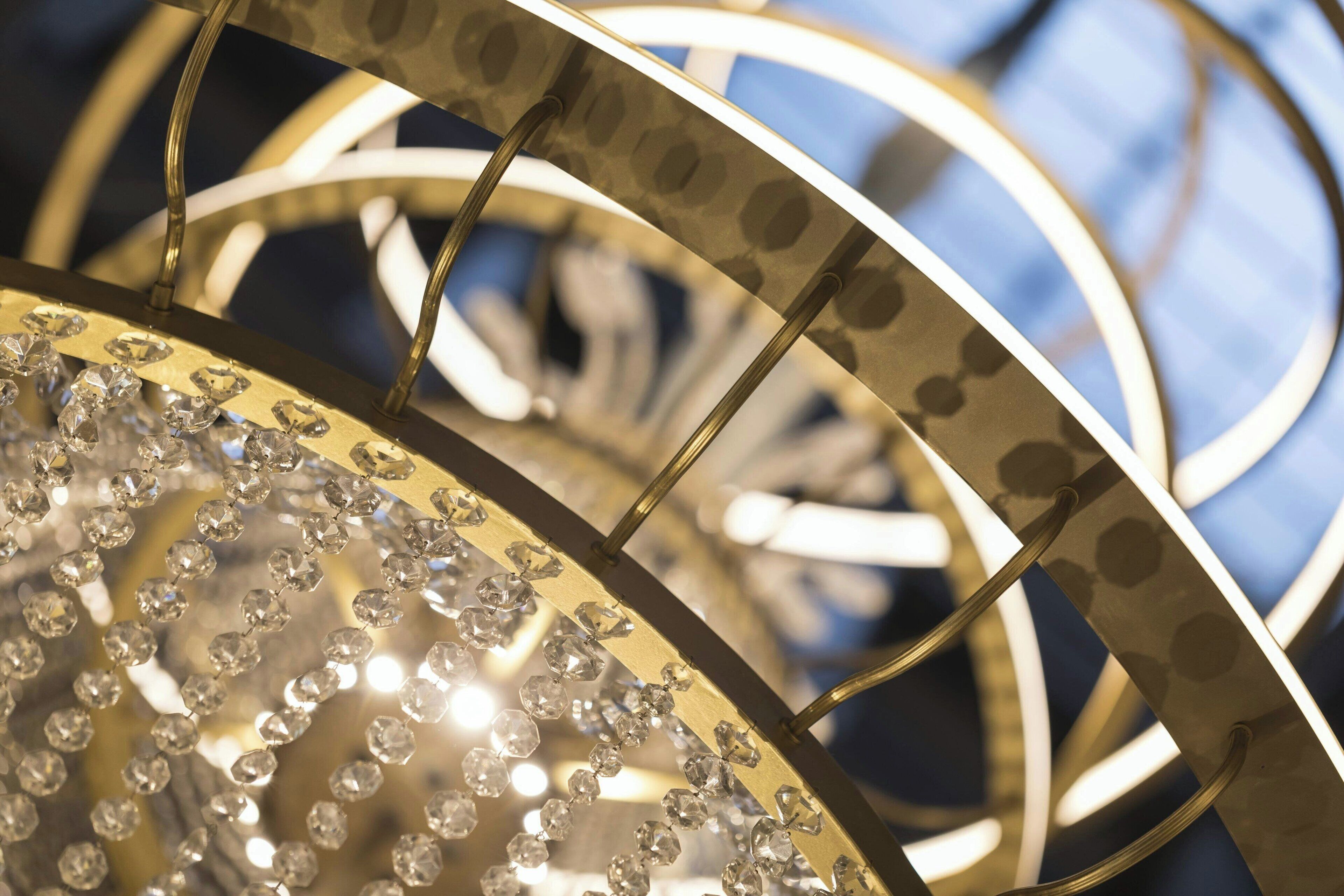 A chandelier with multiple tiers and crystal decorations.