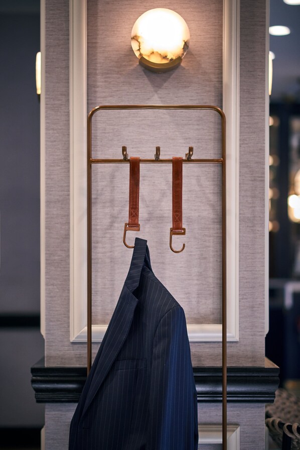 Guests can hang their belongings with ease using the wall-mounted rack system.