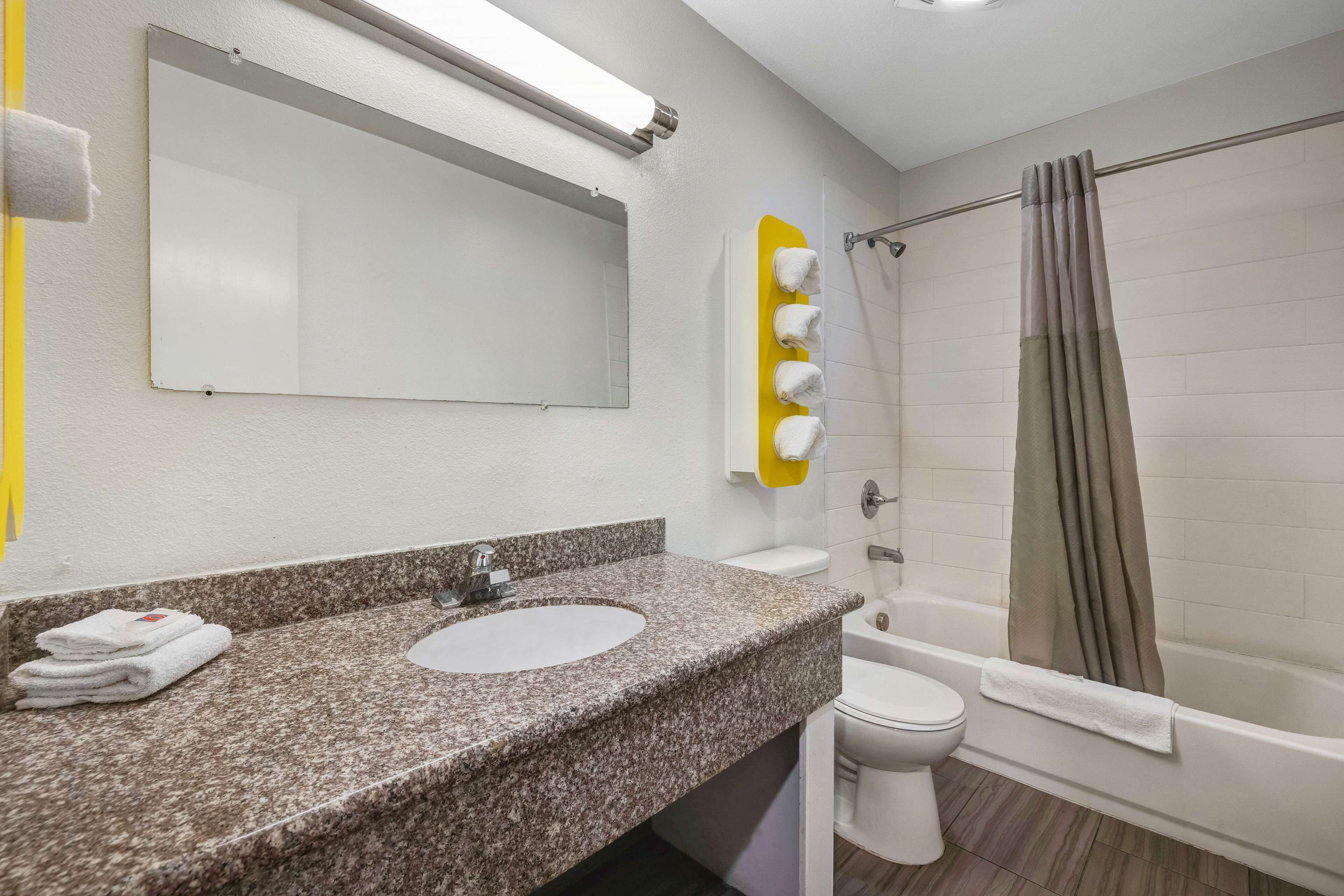 deluxe room, 1 queen bed, non smoking, kitchenette | bathroom | combined shower/bathtub, hair dryer, towels