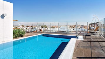 Seasonal outdoor pool, pool loungers