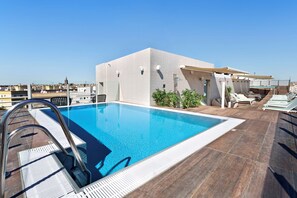 Seasonal outdoor pool, pool loungers