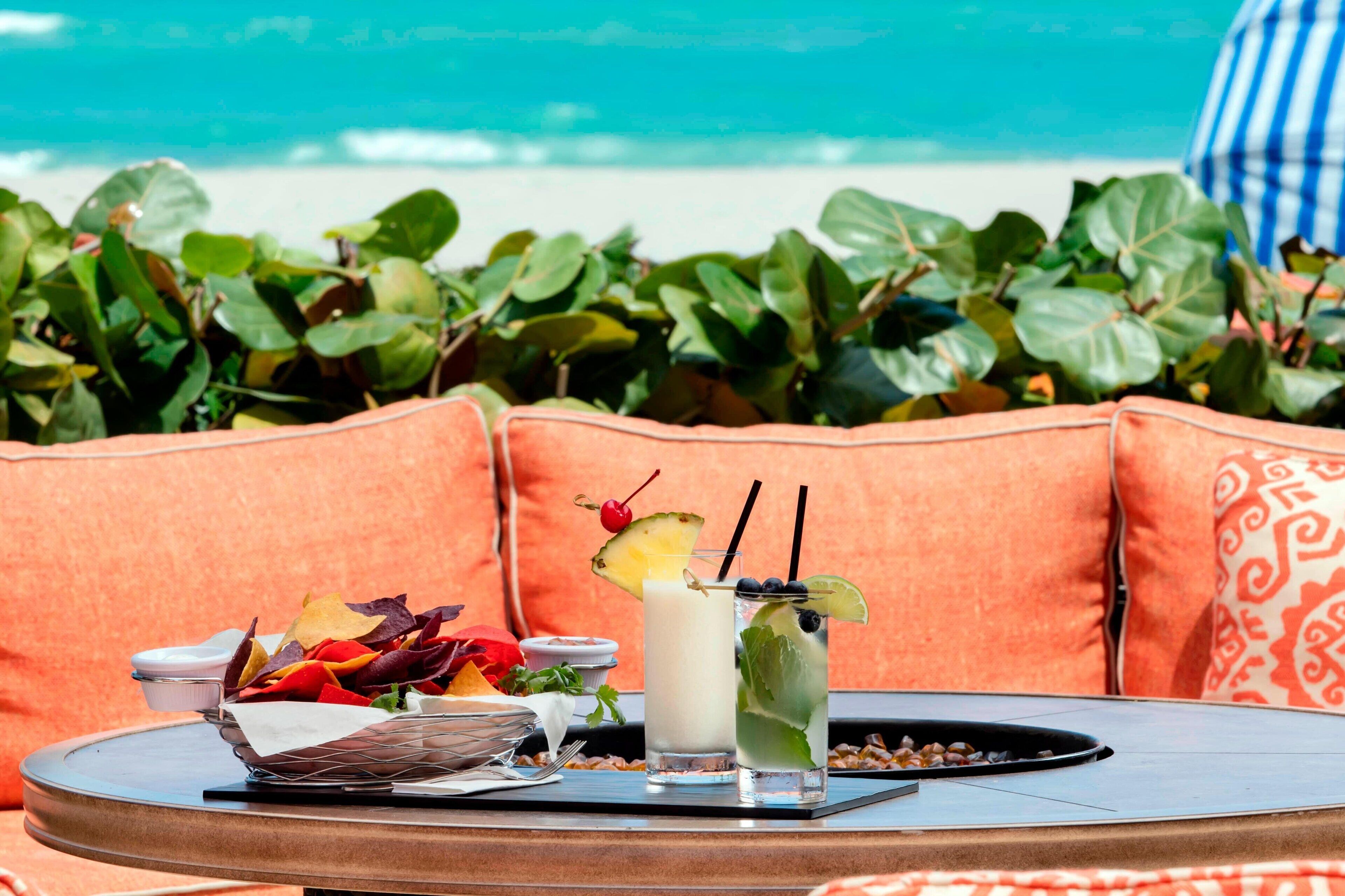 On the beach, white sand, beach cabanas, sun-loungers