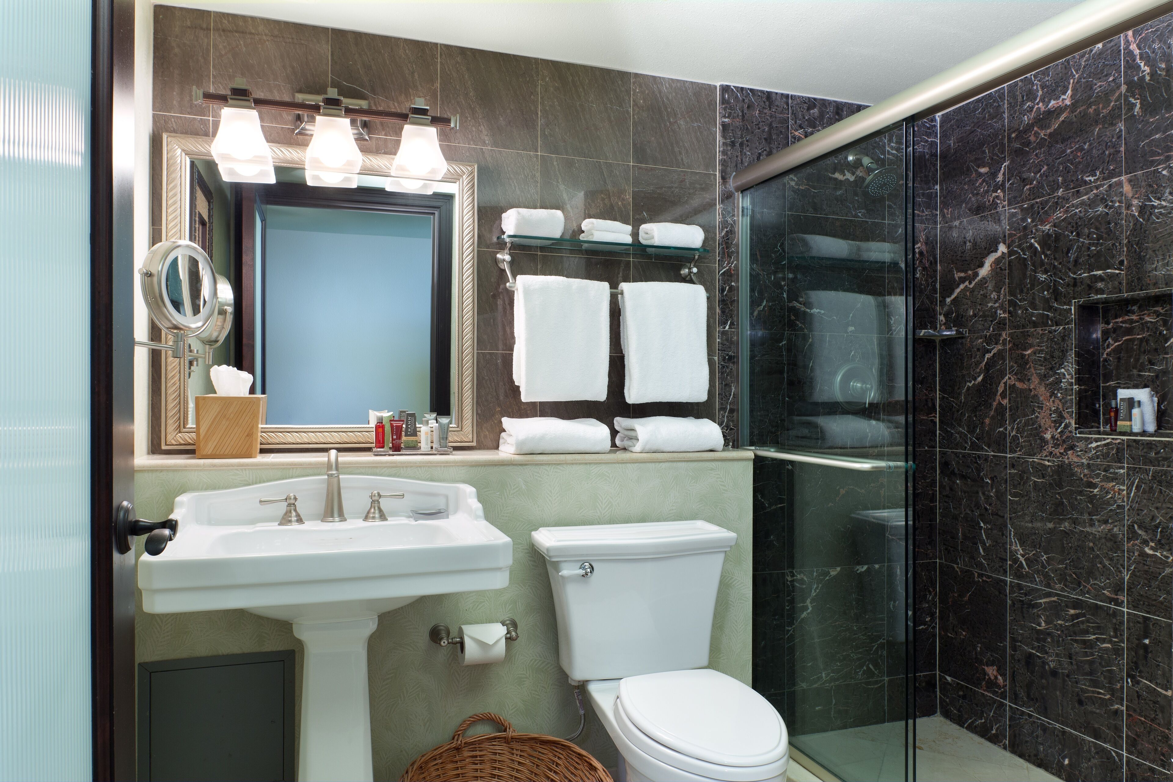 designer toiletries, hair dryer, towels