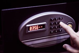 A keypad with a digital display showing the number 8356.