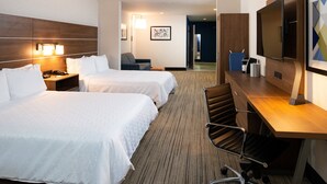 A hotel room with two beds, a desk, a chair, a TV, and a lamp. - Holiday Inn Express & Suites Los Angeles Downtown West by IHG (Los Angeles)