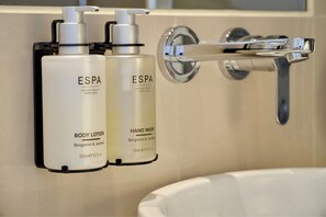 Renovated Cura Luxe | Bathroom | Free toiletries, hair dryer, heated floors, towels