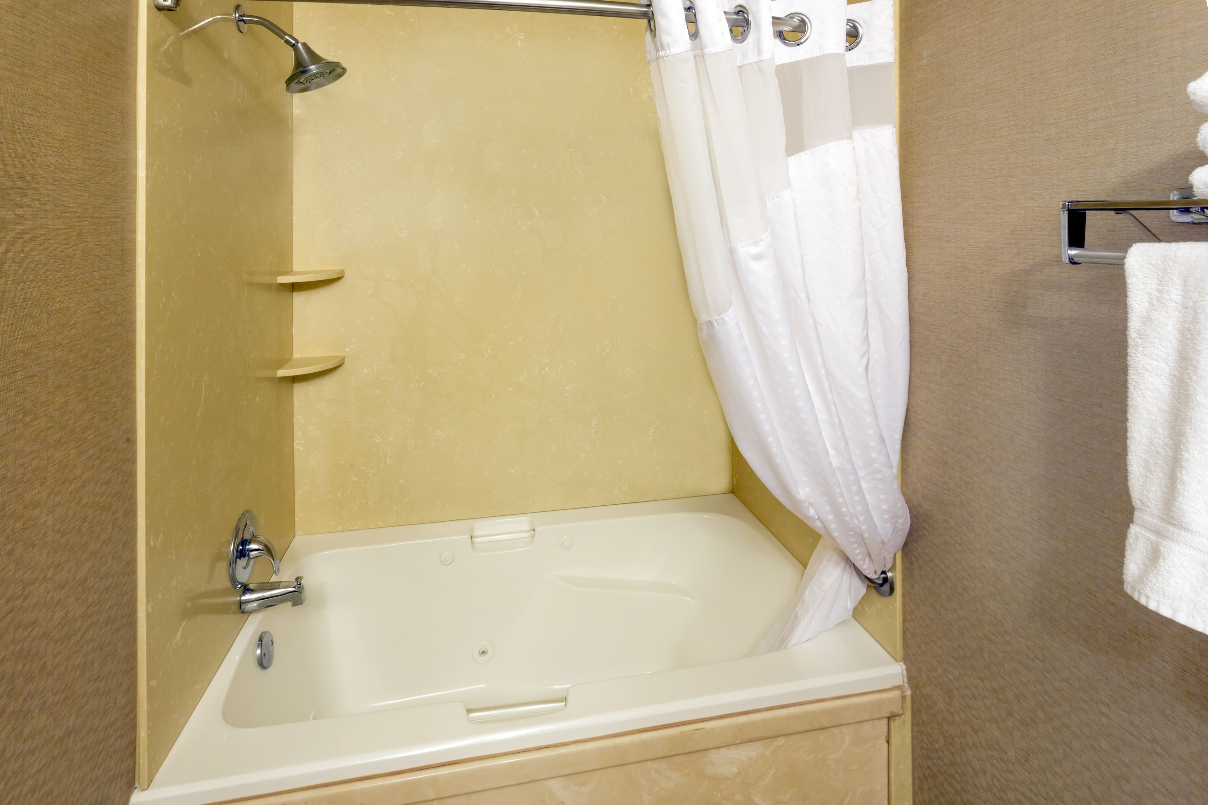 suite, 1 king bed, balcony, river view | bathroom | combined shower/bathtub, hair dryer, towels