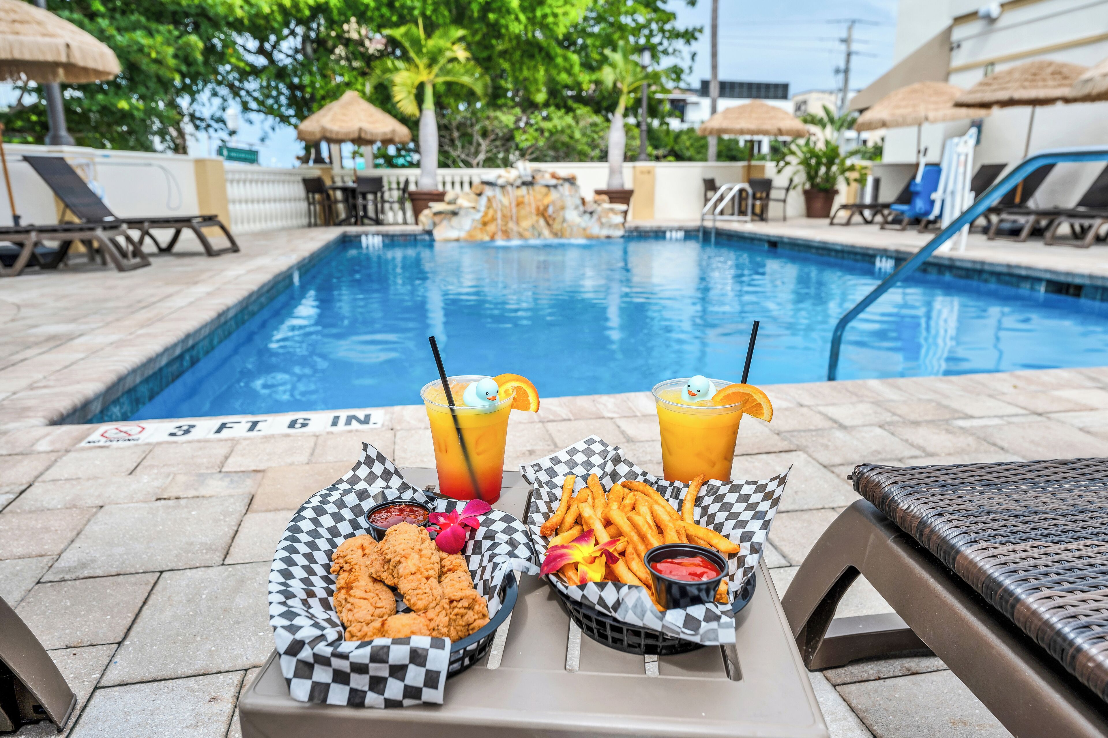 outdoor pool, open 7:00 am to 8:00 pm, pool umbrellas, pool loungers