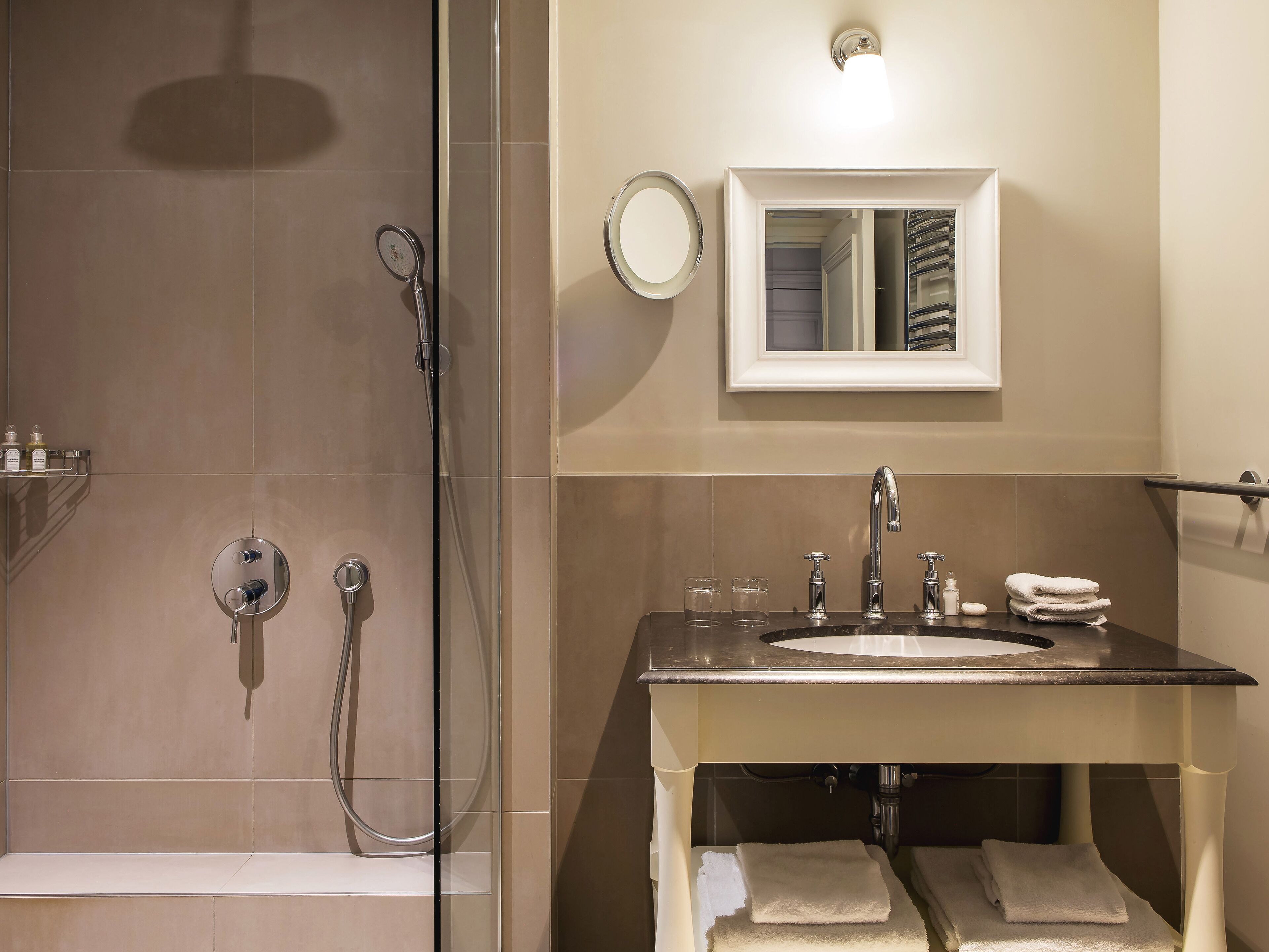deluxe room | bathroom | shower, rainfall showerhead, designer toiletries, hair dryer