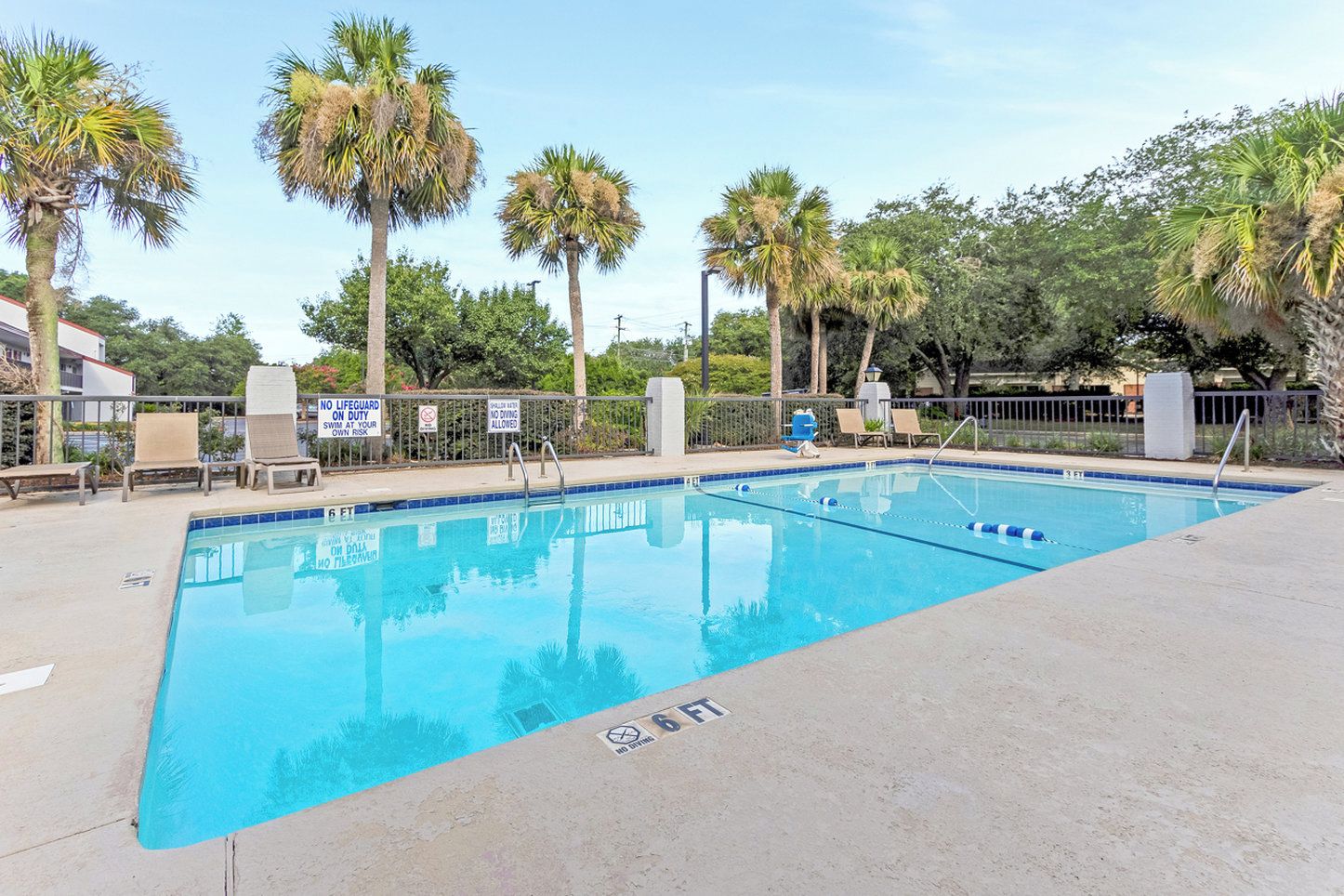 Seasonal outdoor pool, open 10:00 AM to 10:00 PM, pool umbrellas