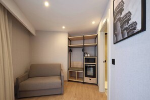 Premium Triple Room, Terrace (Pool) | Minibar, in-room safe, desk, iron/ironing board