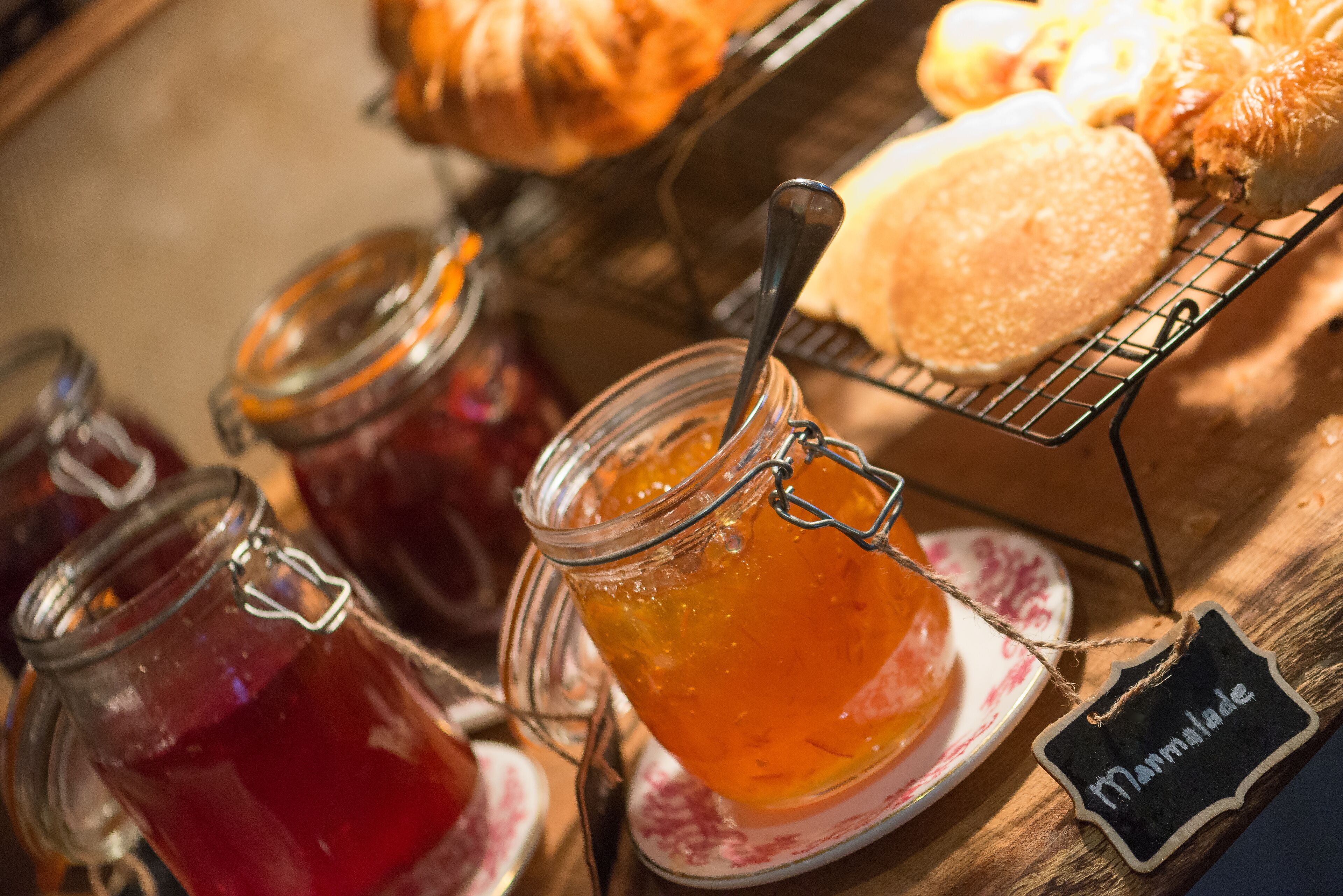 A display of various jams and a sign indicating 'Marmalade'.