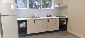 Serviced Apartment | Private kitchen | Fridge, microwave, coffee/tea maker, electric kettle