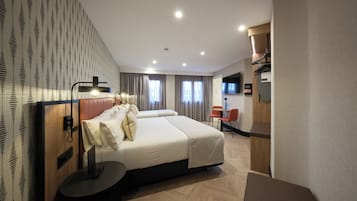 Superior Triple Room (2 adults + 1 children) | Minibar, in-room safe, desk, iron/ironing board