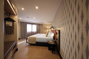 Family Room (Deluxe, 2 adults + 2 children) | Minibar, in-room safe, desk, iron/ironing board