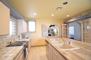 Exclusive Villa, Multiple Beds (Pickford Palms Ranch A-1, 6  mi from) | Private kitchen | Microwave, cookware/dishes/utensils at Miracle Springs Resort & Spa