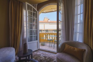 Enjoy the view from your balcony with a sliding glass door leading to a tiled outdoor space.