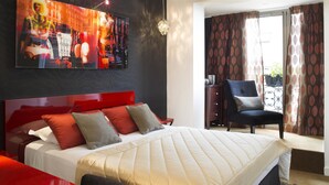 A hotel room with a large bed, a red headboard, and a painting on the wall. - Best Western Anjou Lafayette Opera (Paris)