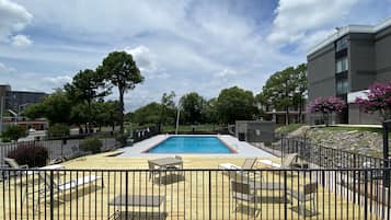 Seasonal outdoor pool, open 10:00 AM to 8:00 PM, pool umbrellas