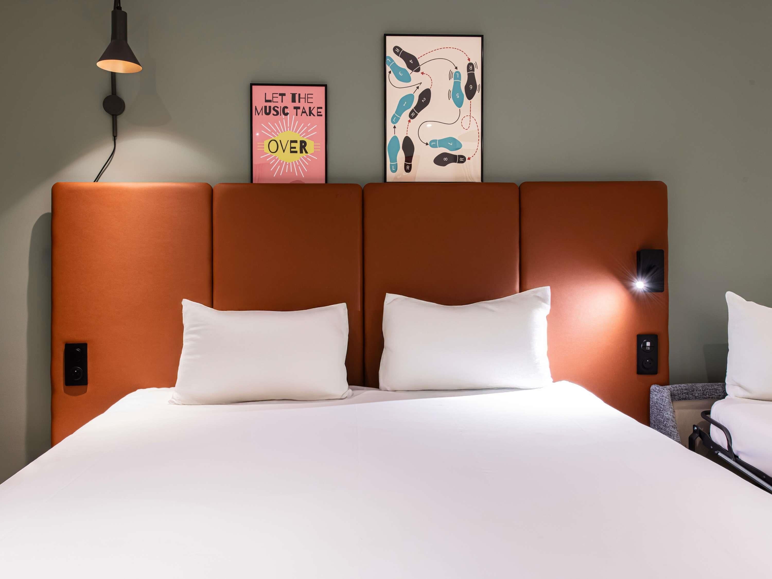 Premium bedding, desk, laptop workspace, blackout drapes