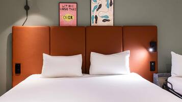 Premium bedding, desk, laptop workspace, blackout drapes