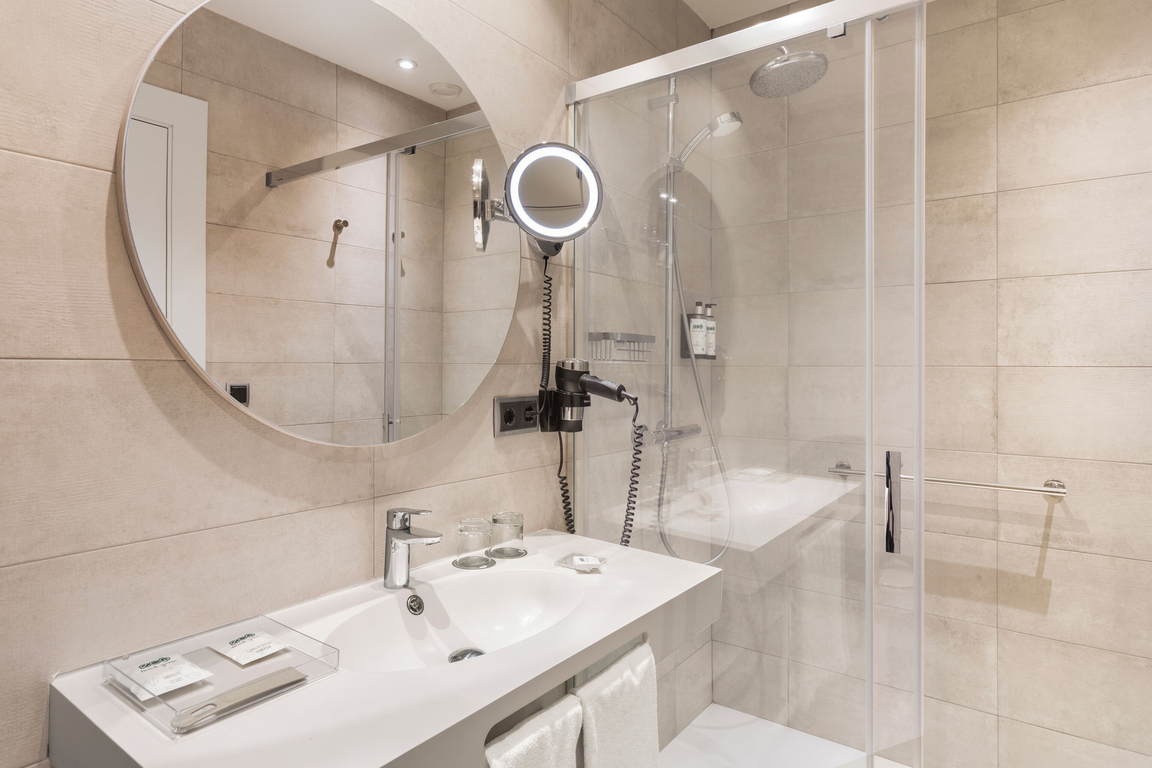 eco-friendly toiletries, hair dryer, towels