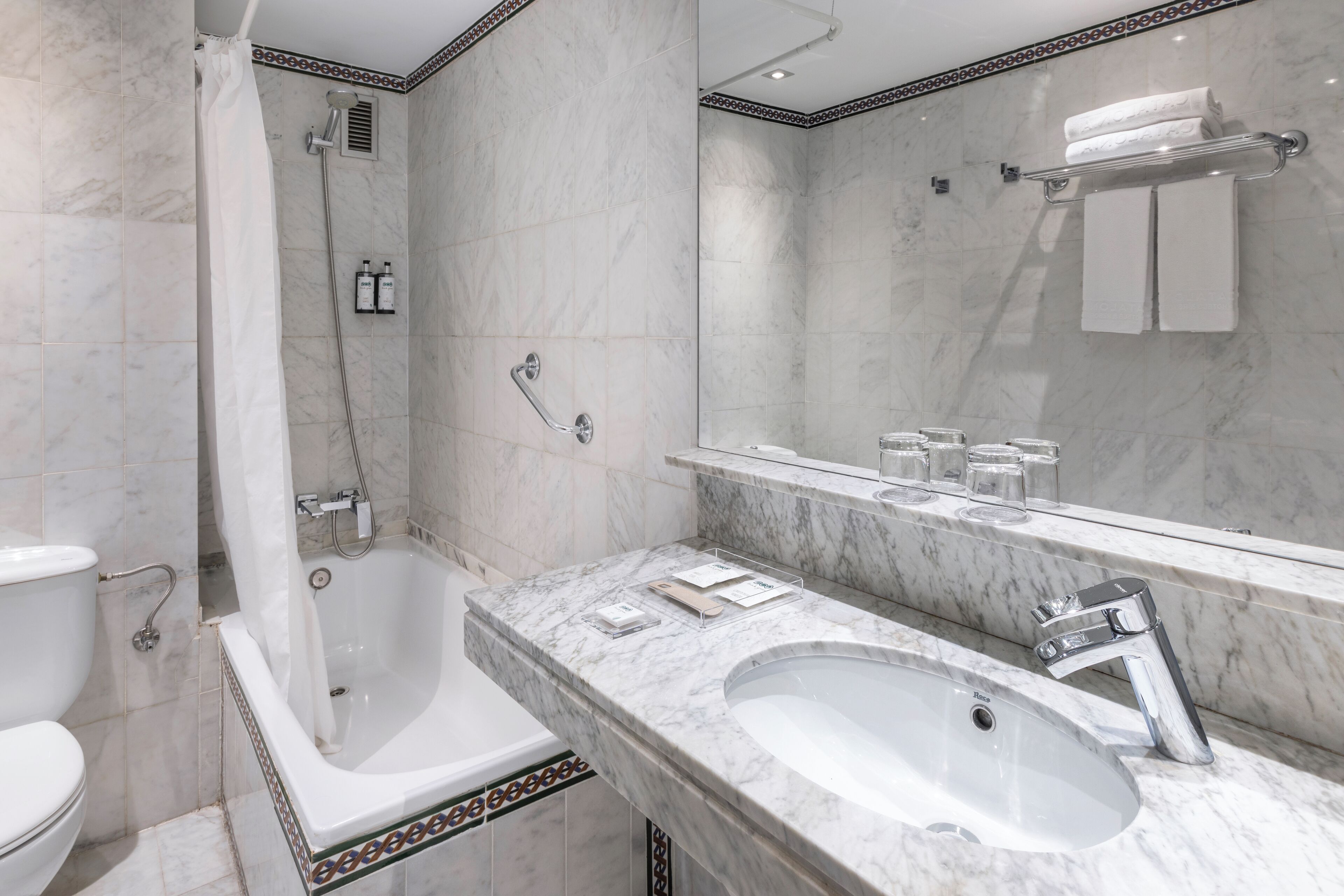 eco-friendly toiletries, hair dryer, towels