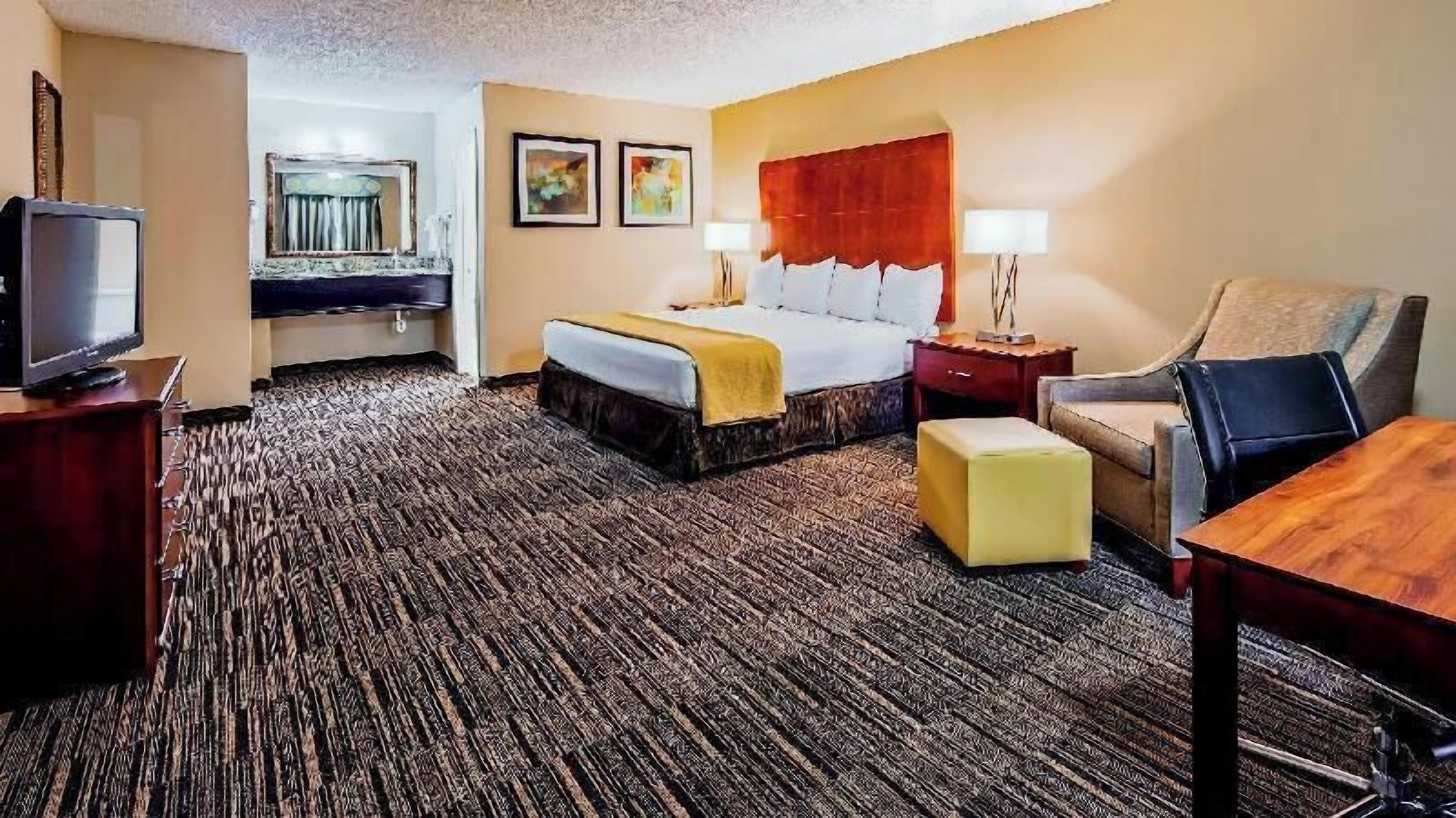 Premium bedding, desk, laptop workspace, iron/ironing board