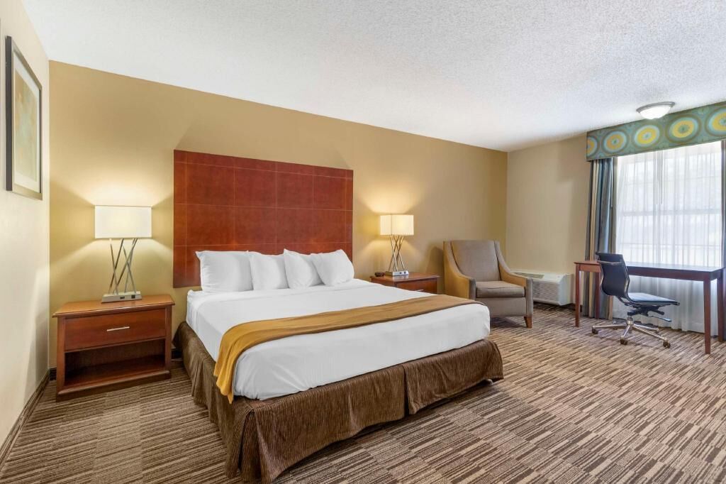 Premium bedding, desk, laptop workspace, iron/ironing board