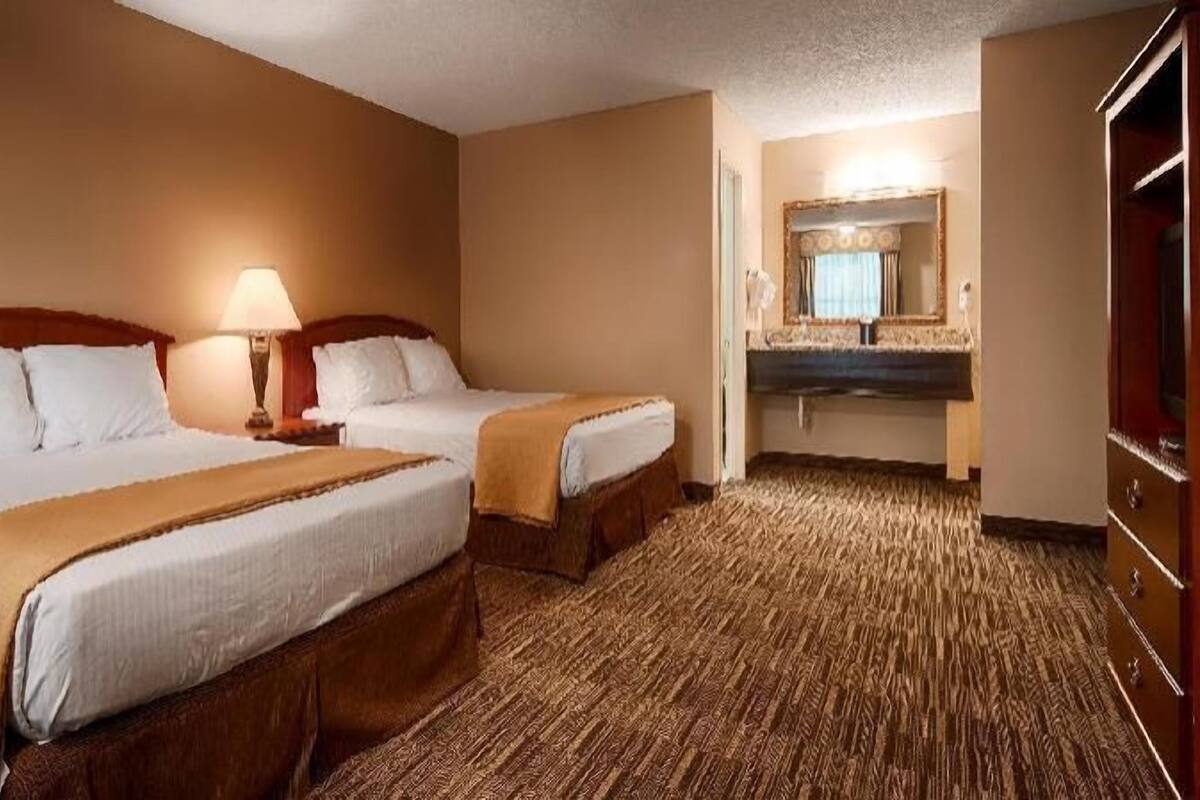 Premium bedding, desk, laptop workspace, iron/ironing board